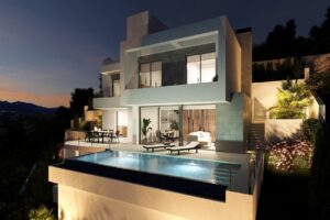 Villa moderna a tre piani con piscina a sfioro e vista panoramica al tramonto.