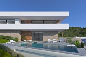 Villa moderna di lusso con piscina, terrazza e architettura contemporanea in pietra e legno.