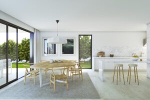 Cucina e sala da pranzo moderne in stile scandinavo con luce naturale e marmo.