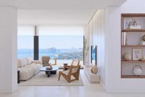 Soggiorno moderno e minimalista con vista panoramica sul mare e sulla costa mediterranea.