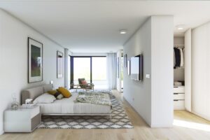 Camera da letto moderna in stile scandinavo con grandi vetrate, letto basso e cabina armadio.