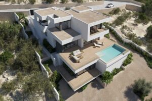 Villa di lusso moderna e geometrica con piscina su una collina arida.