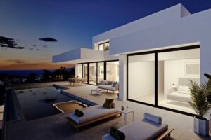 Villa moderna di lusso con piscina a sfioro e vista panoramica sul mare al tramonto.